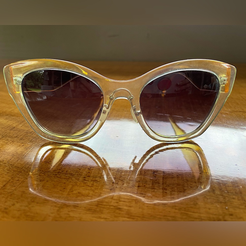 Cat Eye Sunglasses. Clear Frames with Golden Tone Temples